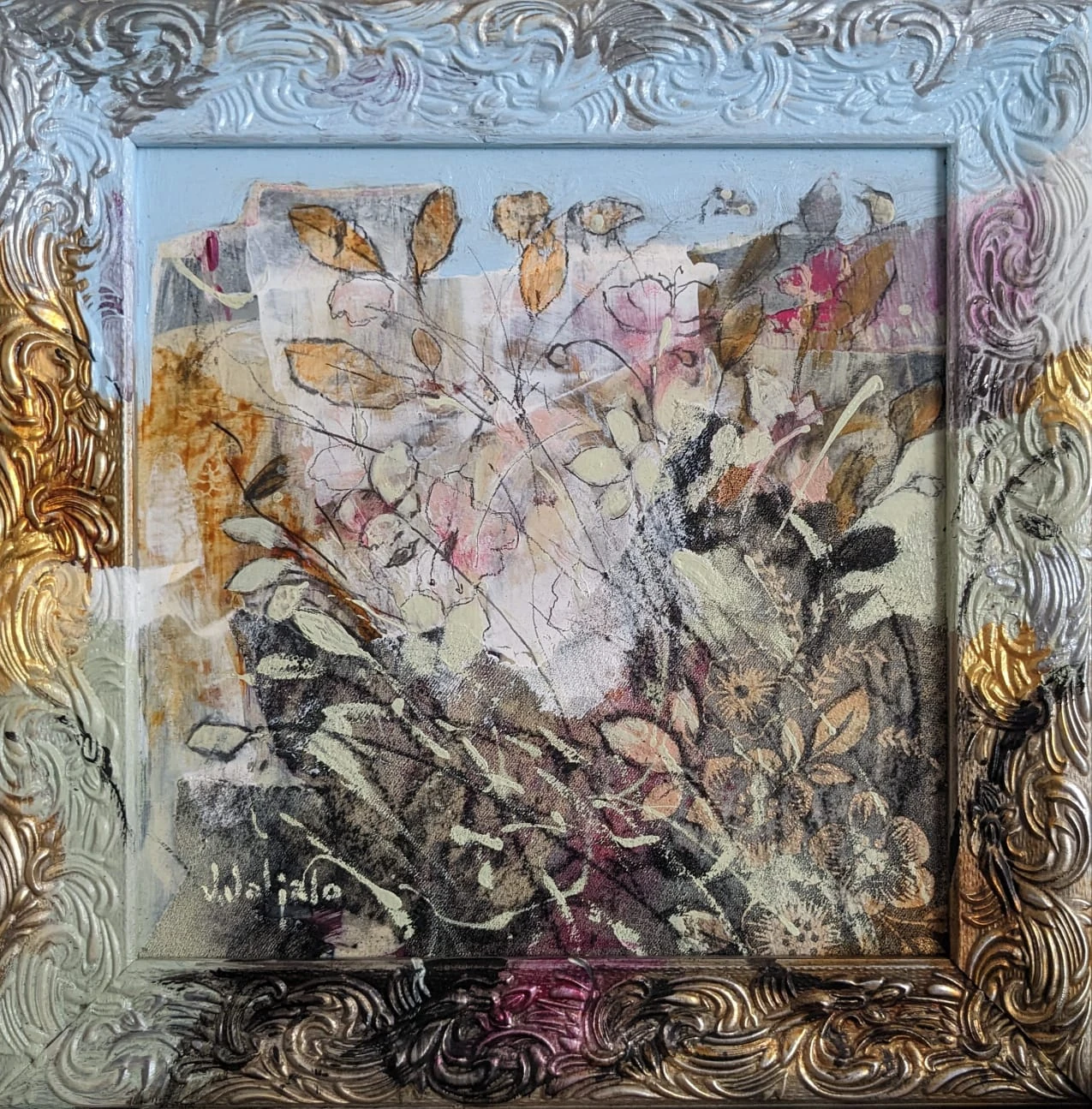 Layered flowers and branches within an ornate frame painted blue, gold and grey.