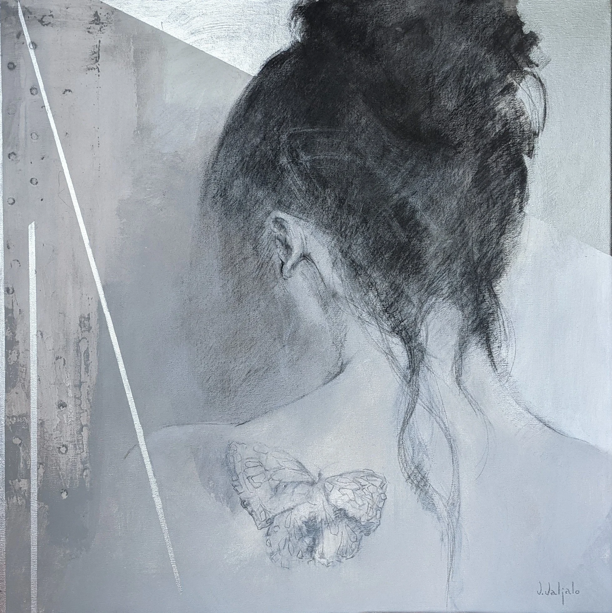 A woman seen from behind with dark hair in a high bun and a butterfly drawn on her shoulder.